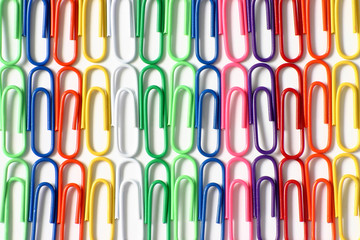 close up of lines of color paper clips