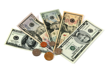 dollar bills and coins, isolated on white