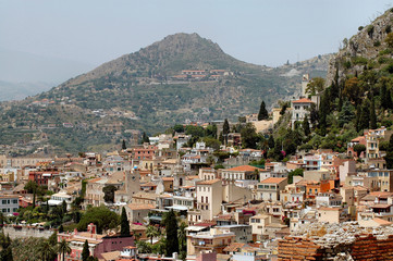 taormina, sicily with mountains in background