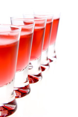 shot glasses of red vodka