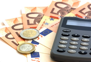 calculator, ero coins and banknotes