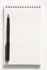 reporter’s notepad and pen