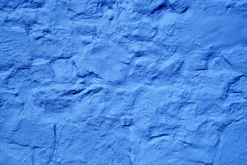 vivid blue color painted wall surface.