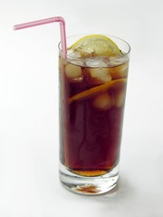 brown drink with ice and lemon-slices