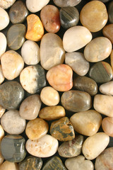 colorful polished pebbles vertical view
