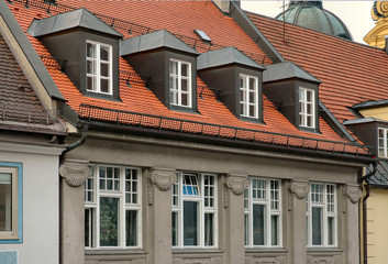 red tile roof and gabled dormer windows in munich,