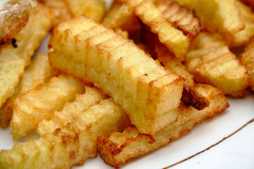 fried potatoes on white plate