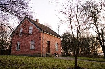 old brick house at sunset