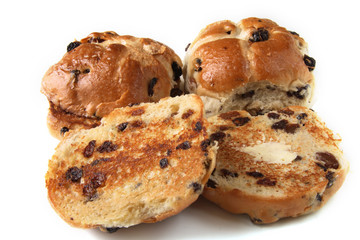 traditional hot cross buns whole and buttered sliced