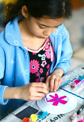 a young girl painting