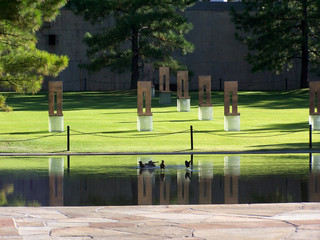 field of empty chairs & reflecting pool