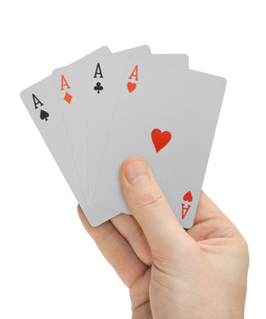 hand with playing cards (four aces)