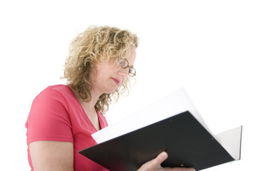 attractive blonde with glasses checking a folder