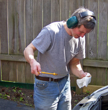 Man Working On Car