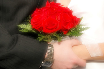 bride and groom holding hands