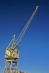 Fototapeta na wymiar harbour crane against blue sky