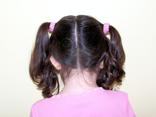 child's hair in pig tails / girl