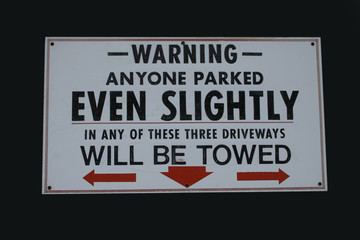 no parking sign with threat of towing