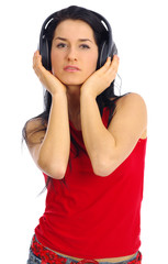 young beautiful women listening music in headphone
