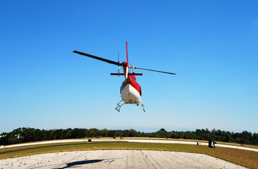 rear view of helicopter taking off