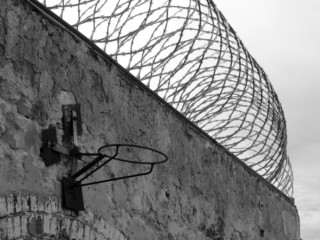 prison wall and razor wire