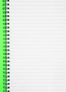 an open spiral notepad with blank lined paper.