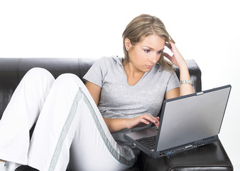 young women on black couch relaxing