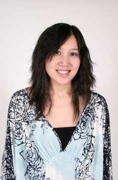 chinese woman smiling in blue