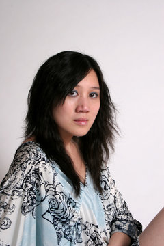 chinese woman looking at camera serious