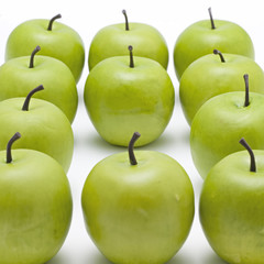 lots of crispy green apples with one missing