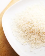 raw white rice in white plate macro 1