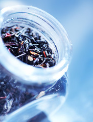 black tea with fruits in a glass jar