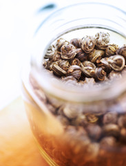 green tea in a glass jar 3