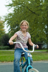 Fototapeta na wymiar young girl on bike