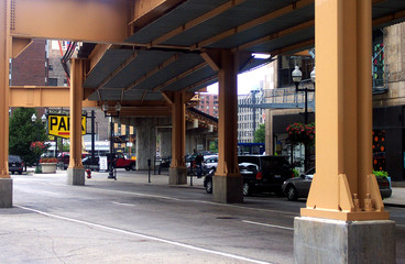 street under elevated train tracks