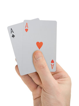 hand with playing cards (two aces), isolated on white