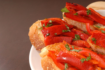 side view of roasted red pepper and basil bruschetta