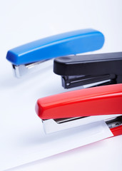 three staplers