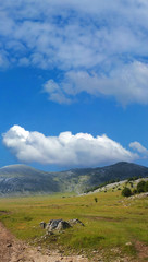 dinara mountain over blue sky 1