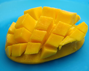 mango in cubes on blue