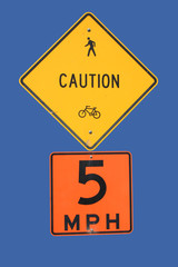 caution cyclists and pedestrians slow