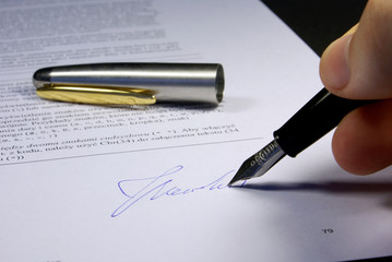 signing contract black background