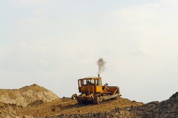 bulldozer on sand heap
