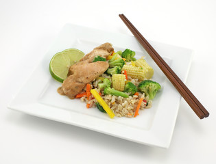 thai chicken with rice and fresh vegetables