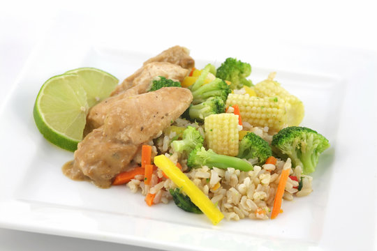 thai chicken with rice and fresh vegetables