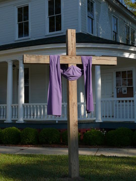 cross in front of porch