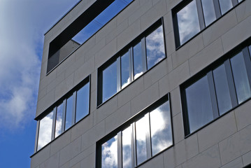 modern facade and ominous sky