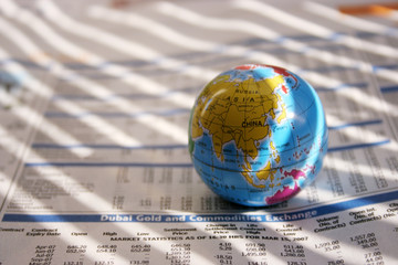 globe on a financial newspaper