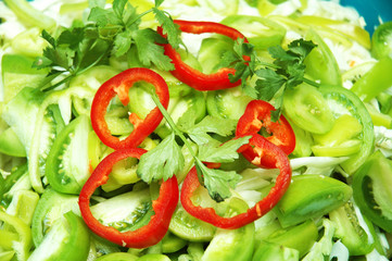 close up of salad with fresh herbs and bell peppers