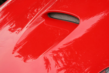 red supercar hood